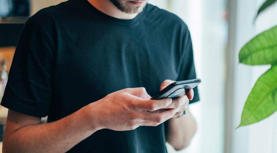 Student using phone for mobile data