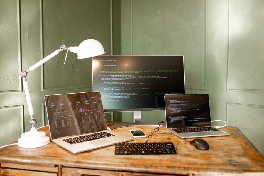 code on three monitors