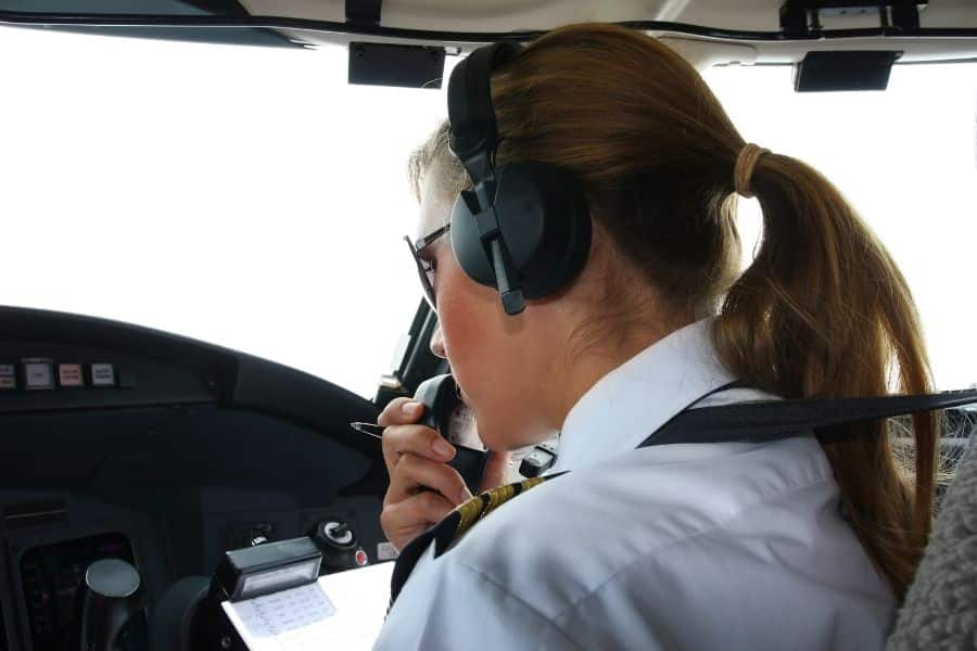 female pilot flying airplaine