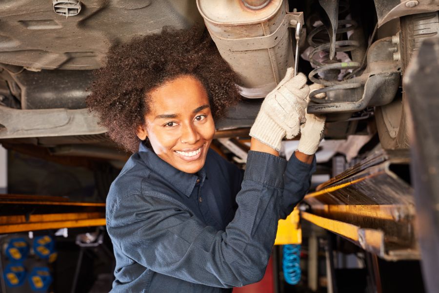 diesel mechanic working on car engine