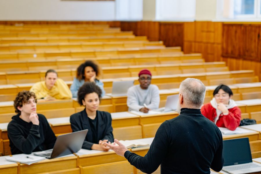 students attending lecture at university