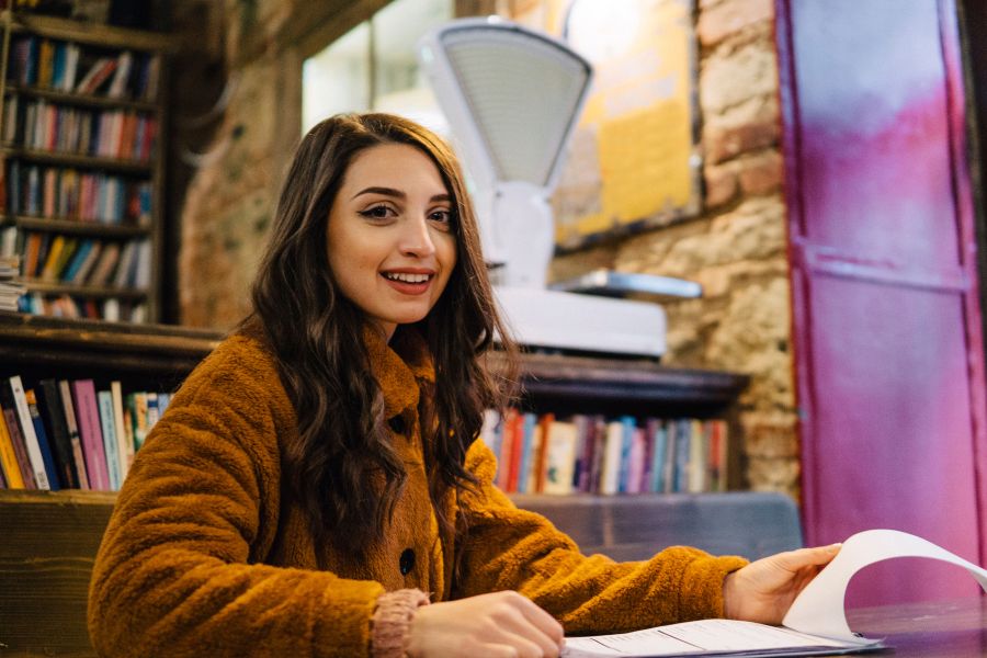 student studying at university library