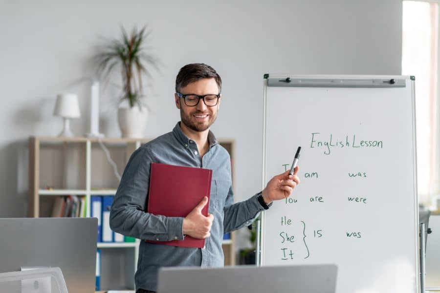 online english teacher standing while teaching a lesson