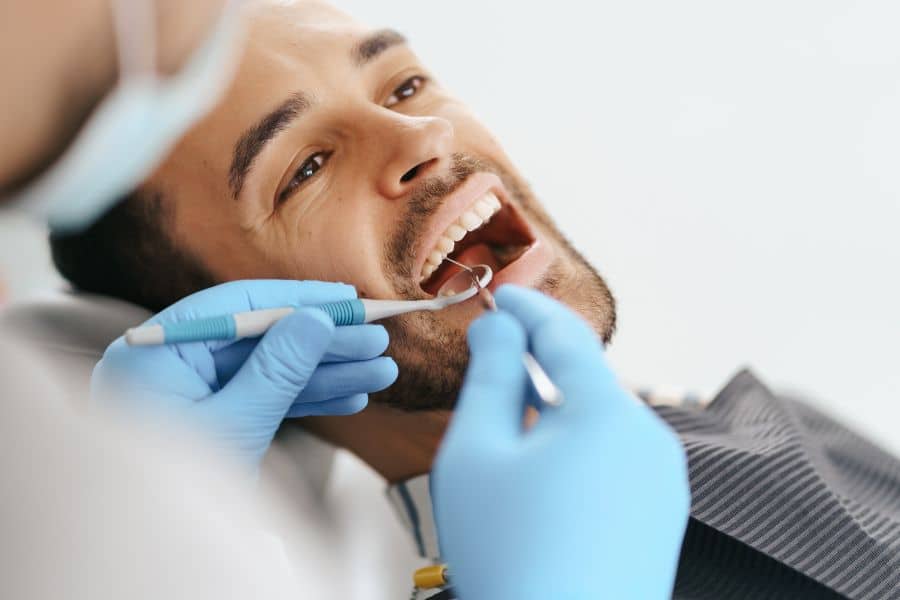 man working in one of the most in demand careers in 2025 as a dentist