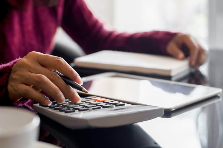 student calculating adult matric cost