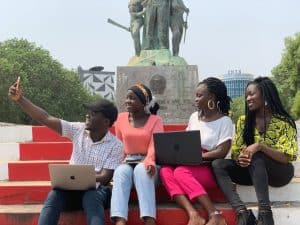 South African students studying together with laptops on a university campus
