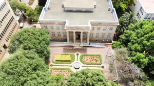 South African university campus — aerial view of buildings surrounded by trees