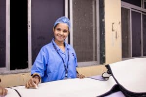 South African nursing student in scrubs during clinical training at a hospital ward