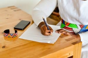Student reviewing TUT application fee documents at a university registration counter