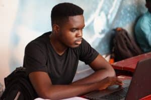 Student using a laptop computer to apply to university online
